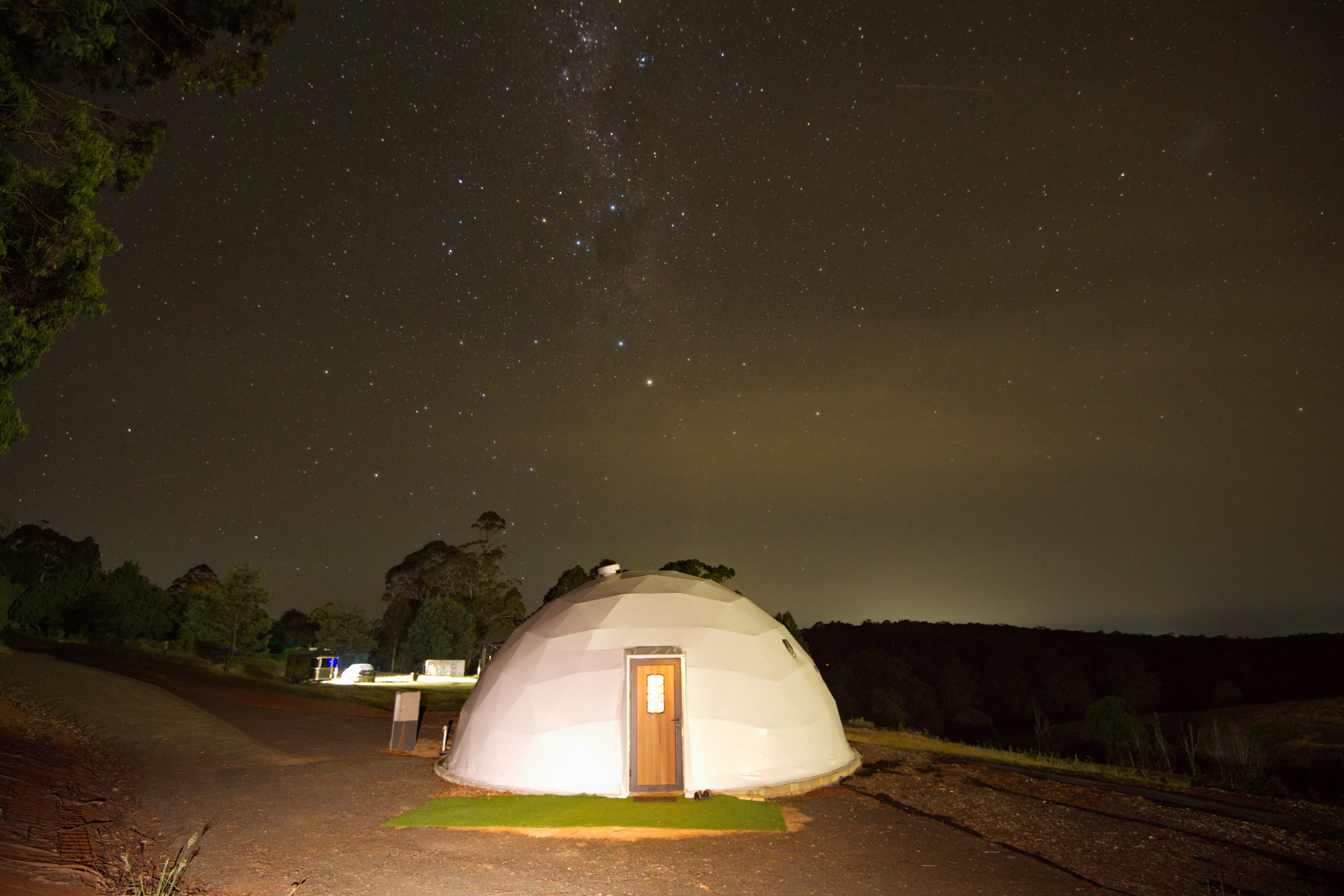 Geodesic glamping dome under the Milky Way night sky in Rawson Victoria