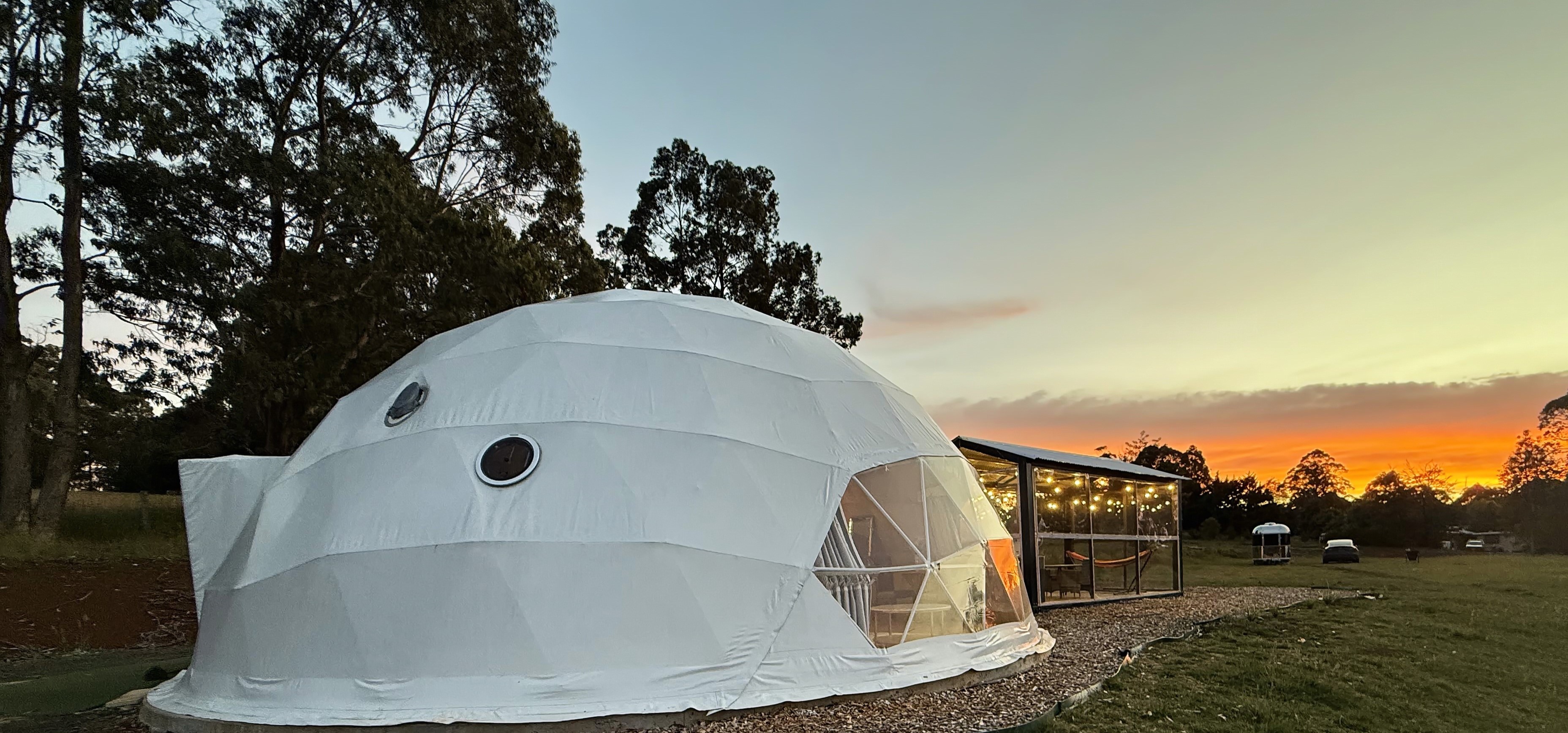 Glamping dome and pavilion at sunset in Gippsland Victoria